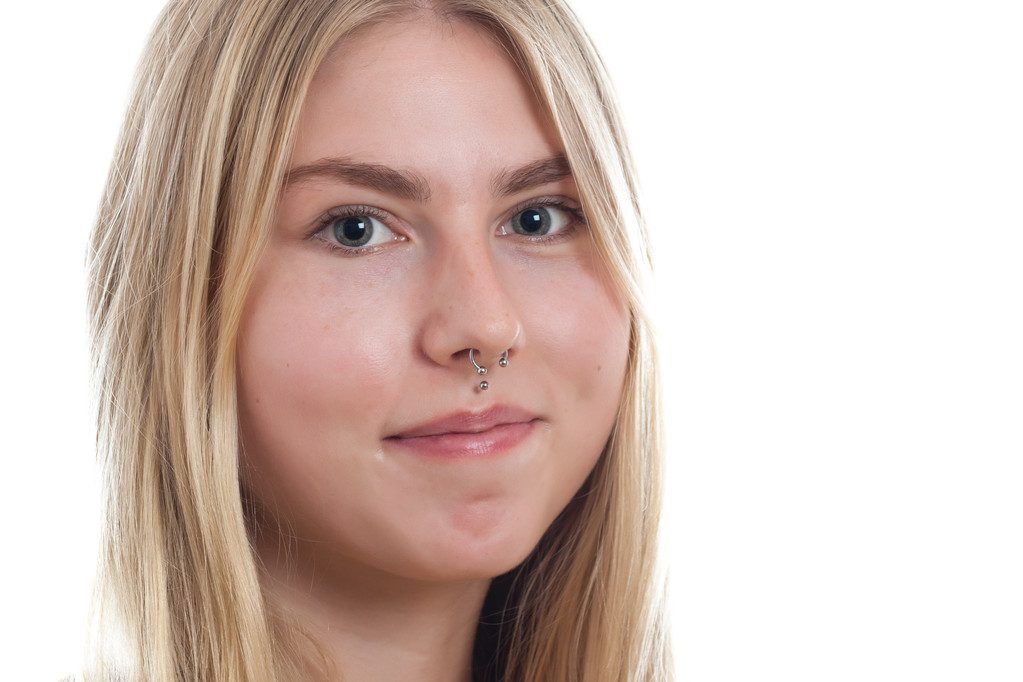 Blonde girl modern nose piercing