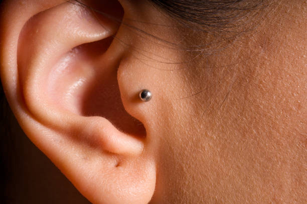 female simple ear tragus piercing